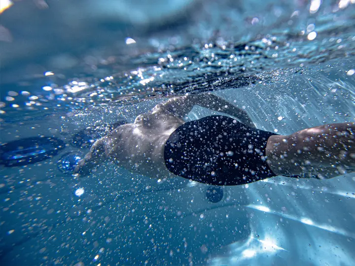 Man swimming in a Jacuzzi PowerPro swim spa